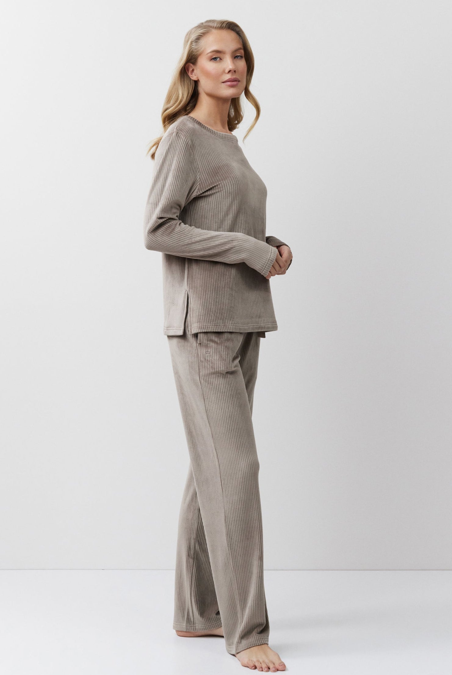 Woman wearing a Capucine outfit on a white background