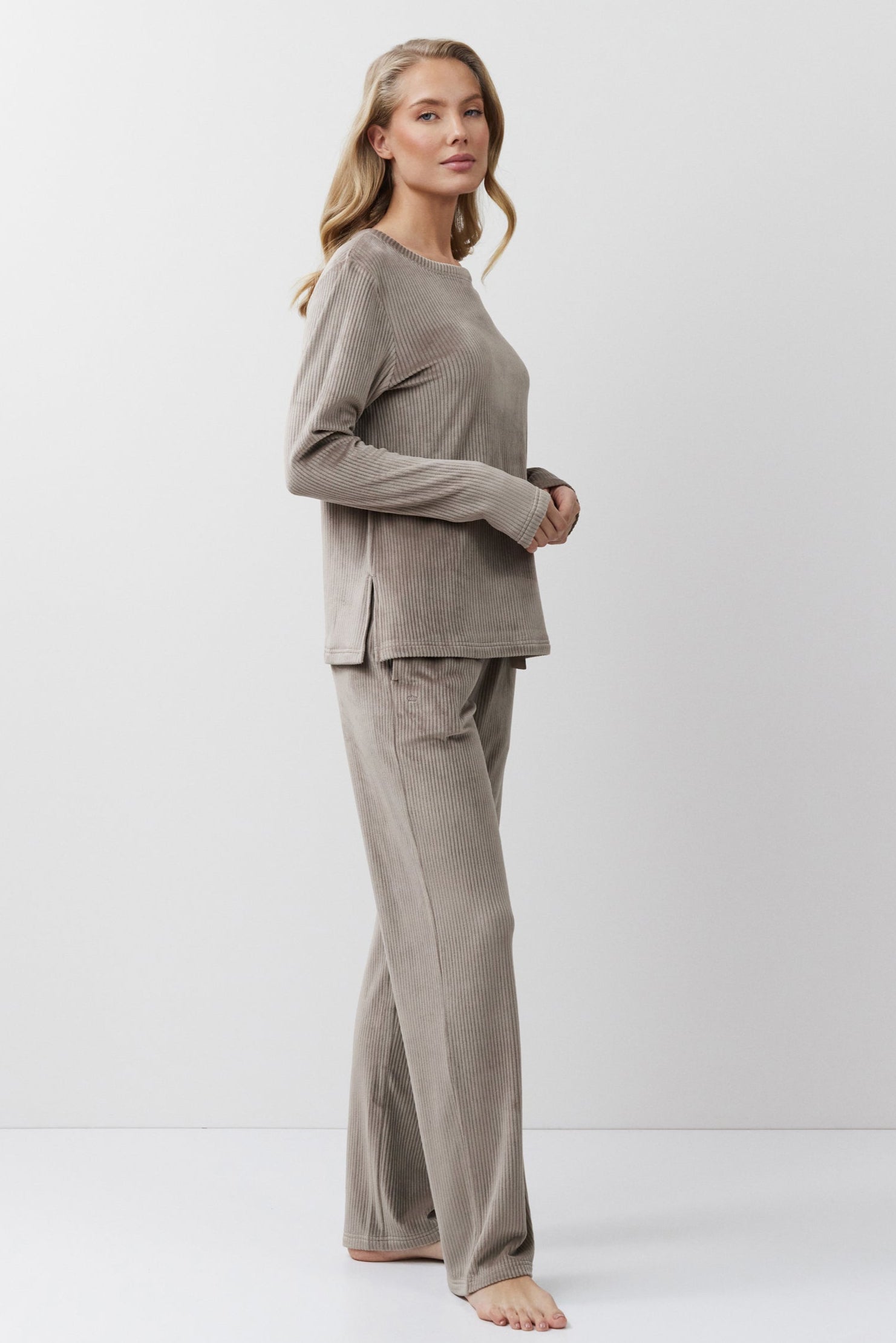 Woman wearing a Capucine outfit on a white background