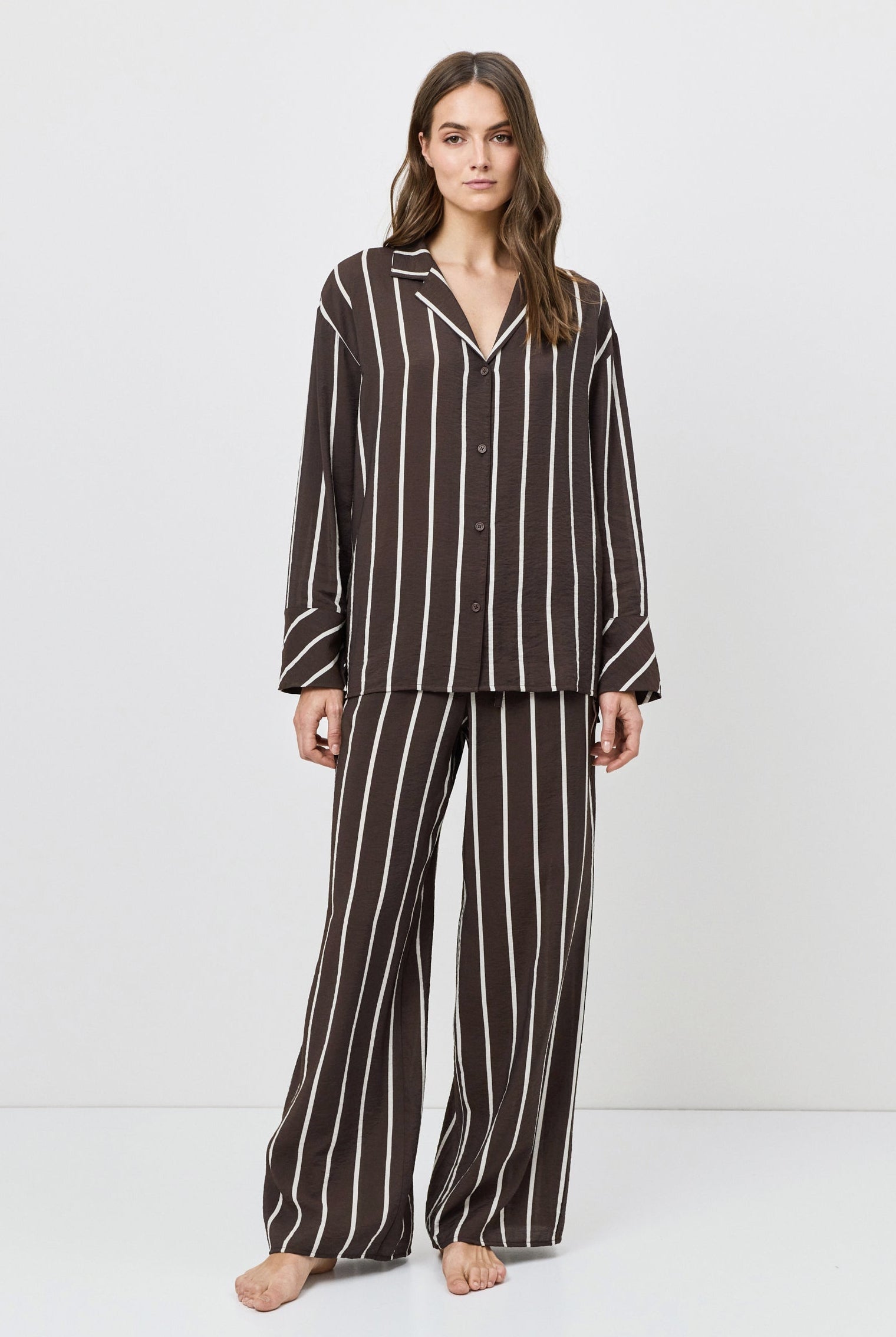 Woman wearing a resort wear set on a white background