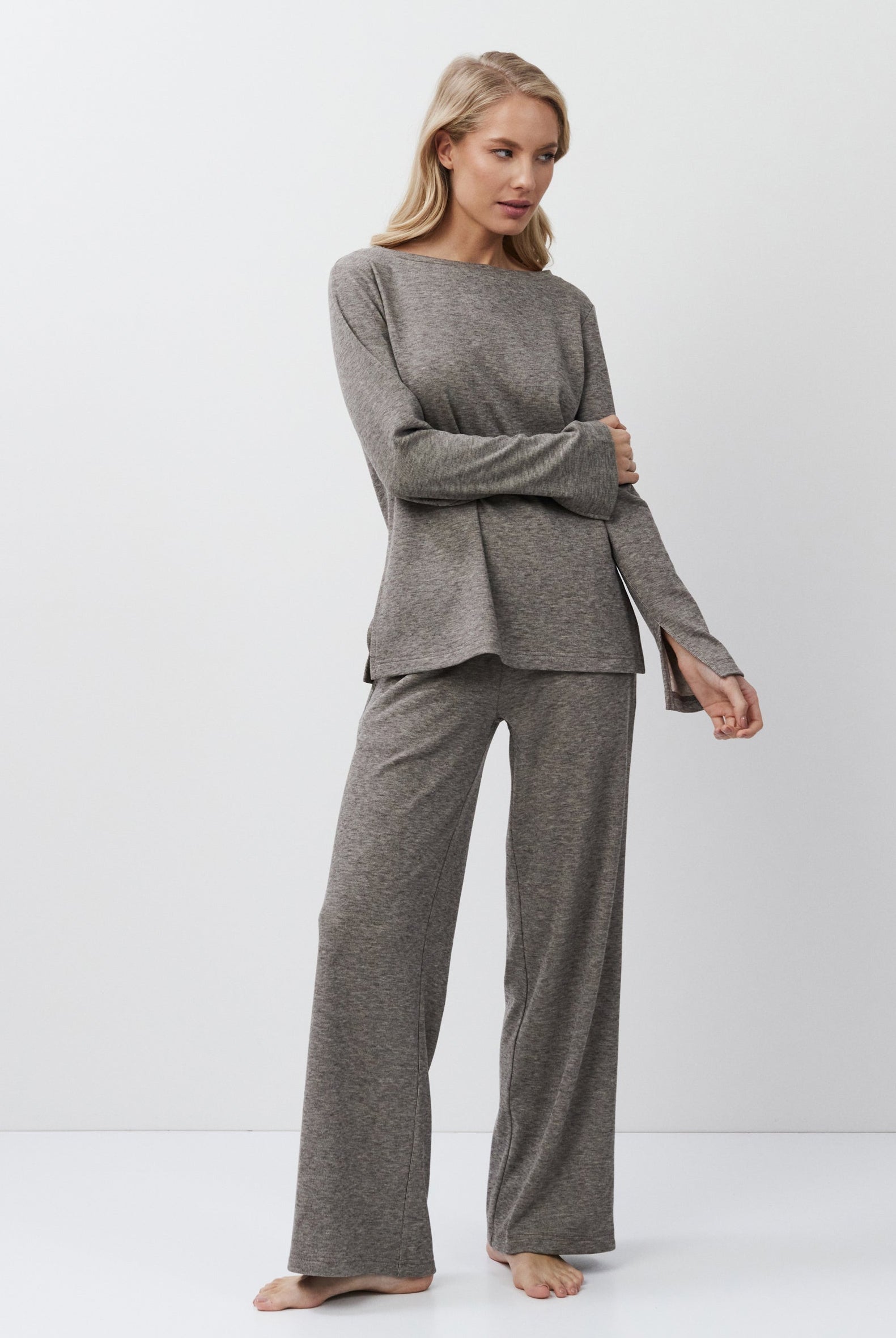 Woman wearing a brown outfit on a white background