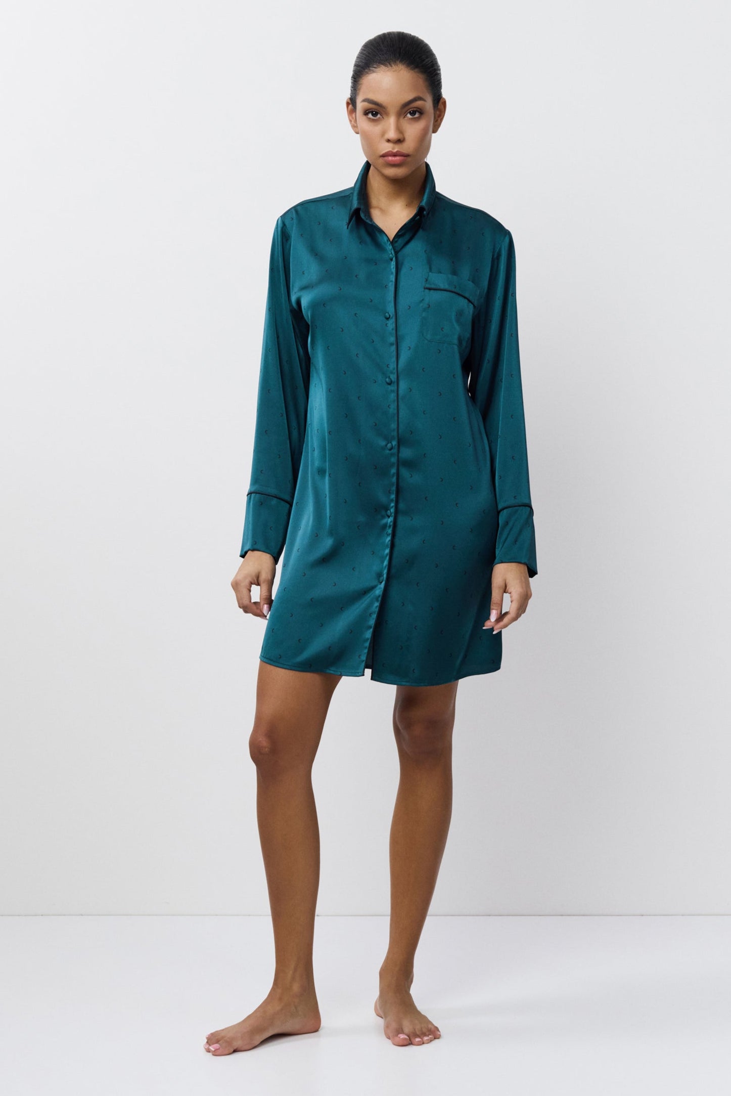 Person wearing a shirt nightdress on a white background