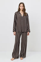 Woman wearing a resort wear set on a white background