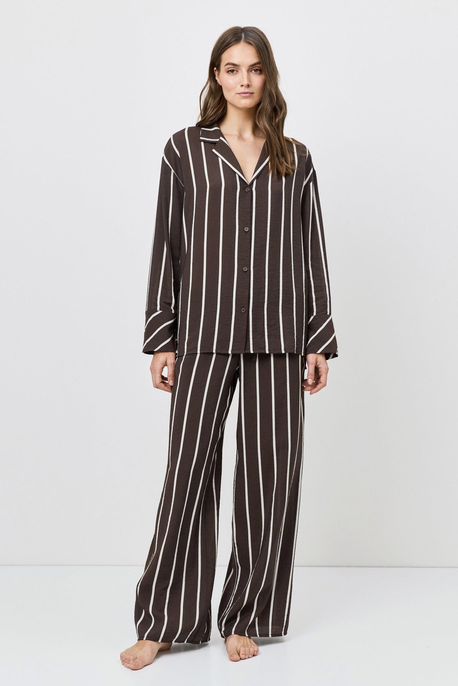 Woman wearing a resort wear set on a white background