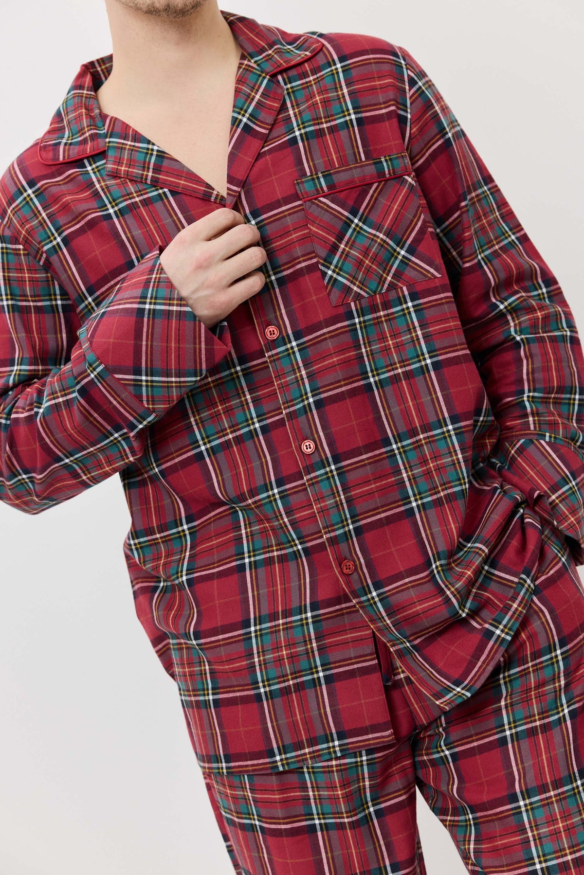 Red plaid pajama set worn by a person on a white background