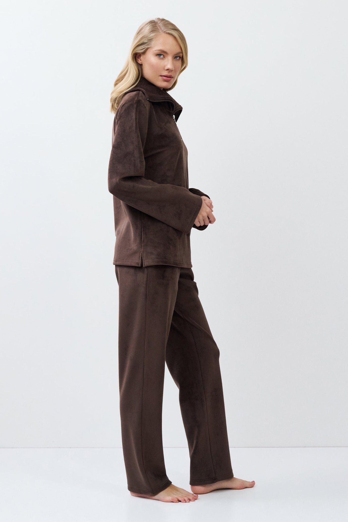 Woman wearing a brown outfit on a white background